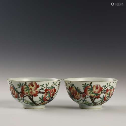 A pair of pink pomegranate bowls