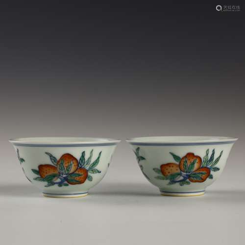 A pair of doucai longevity peach cups