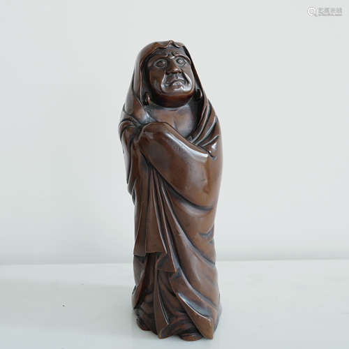 A HARDWOOD CARVING DAMO STATUE