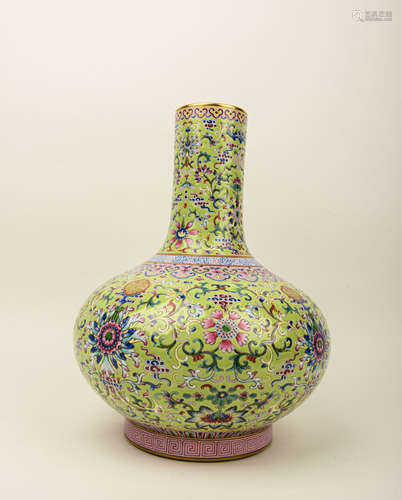 A FAMILLE ROSE LIME-GREEN GROUND 'FLORAL' BOTTLE VASE