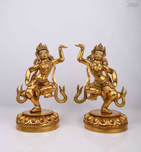 A PAIR OF GILT-BRONZE FIGURES OF GUANYIN