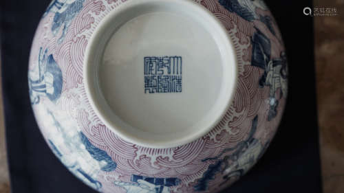 A CHINESE CARMINE RED EIGHT IMMORTALS BOWL WITH ‘DA QING QIA...