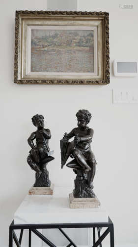 A PAIR OF BRONZE CHILDREN STATURES