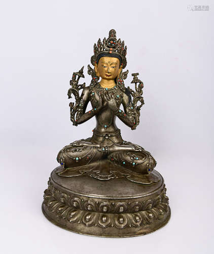 A STERLING SILVER AND GILDING STATUE OF BUDDHA