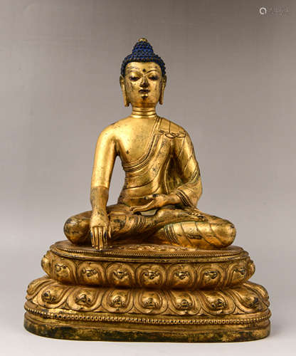 A GILT-BRONZE FIGURE OF BUDDHA SHAKYAMUNI