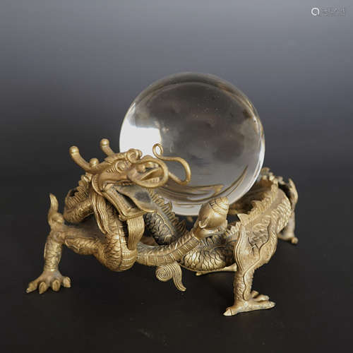 A GILT BRONZE ‘DOUBLE DRAGONS PLAY A CRYSTAL BALL’ ORNAMENT