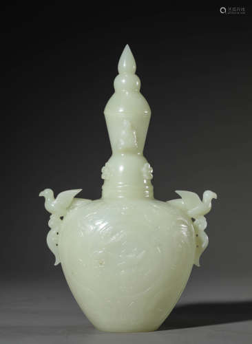 A Chinese White Jade Rosefinch Vase and Cover