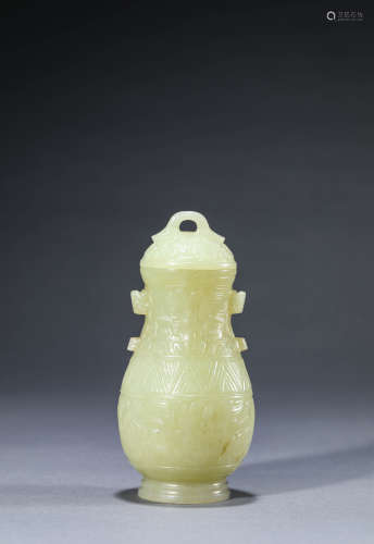 A Chinese Jade Tao Tie Mask Vase and Cover