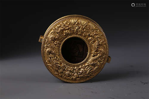 A Gilt Copper Round Buddhist Plate.