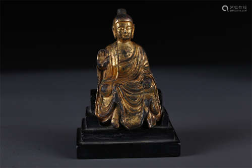 A Gilt Copper Vairocana Buddha Statue.