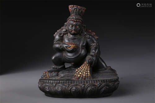 A Black Stone Buddha Statue.