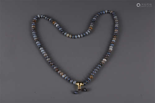 A Necklace of Agate Beads.