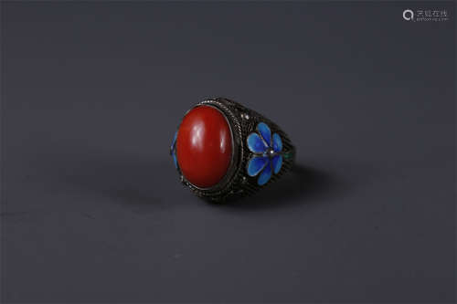 A Silver Bluing Ring with Coral Inlay.