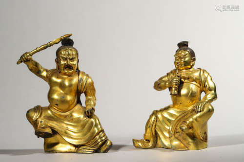 Two Gilt Bronze Figures of Seated Guardian