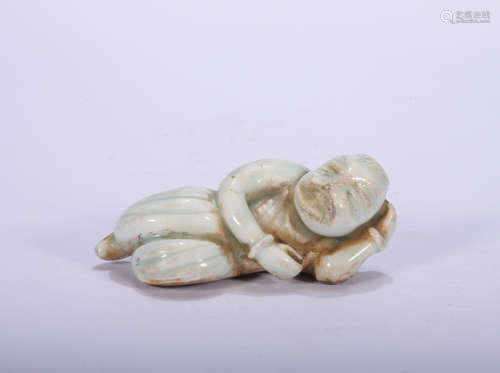 A celadon-glazed figure