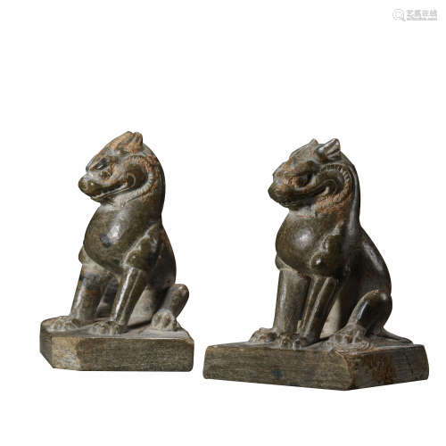 PAIR OF CHINESE TANG DYNASTY BLUESTONE CARVED LIONS, 7TH CEN...