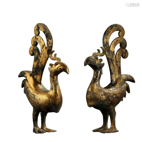 A PAIR OF CHINESE HAN DYNASTY GILT BRONZE PHOENIXES, 1ST CEN...