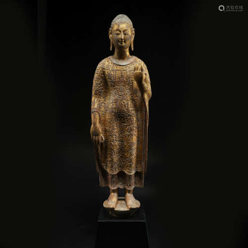 STONE CARVED PARTLY GILT STANDING BUDDHA STATUE, THE NORTHER...