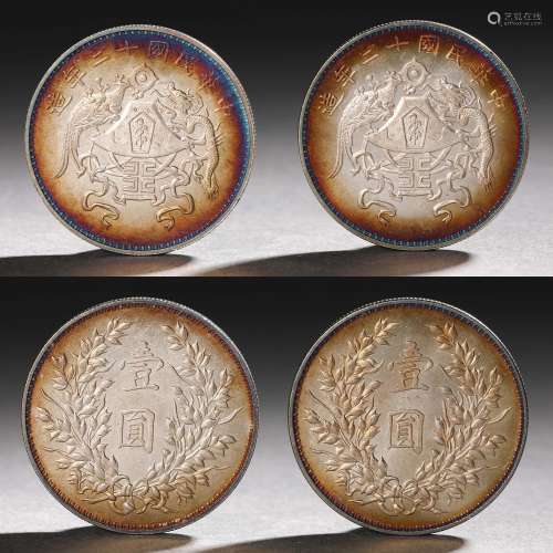 Two multicolored silver coins with double dragon pattern in ...