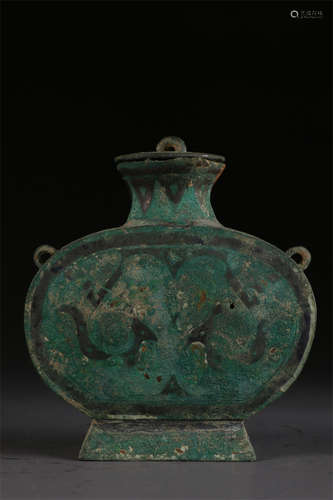 A Copper Lidded Bottle with Gold Inlay.