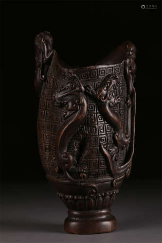 An Agarwood Cup with Dragon Design.