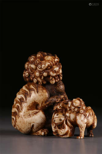 A Bone made Lion and Lionet Sculpture.