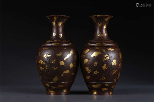 A Set of Gilt Copper Display Bottles.