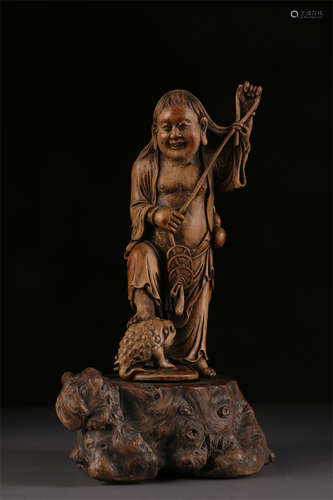 A Sandalwood Liuhai and Gold-Toad Sculpture.