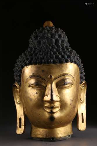 A Gilt Copper Buddha's Head Sculpture.