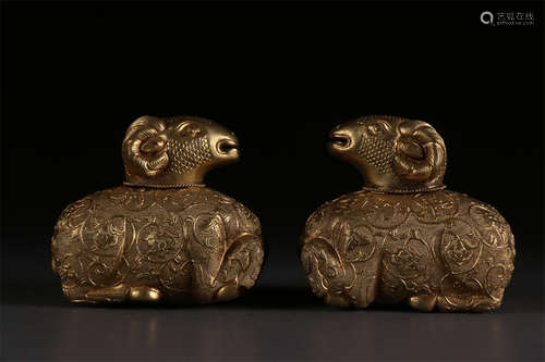 A Group of Gilt Copper Lying Goat Sculptures.