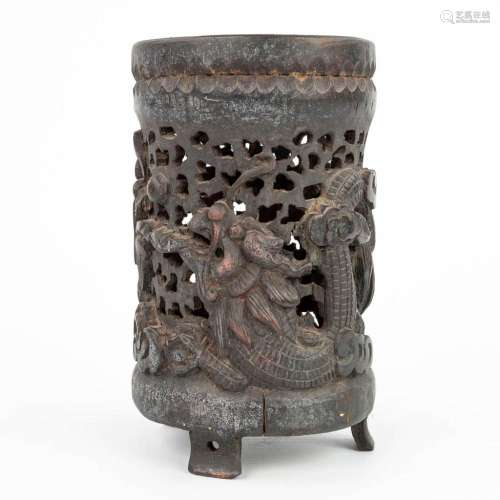 An ajoured vase made of sculptured hardwood with a dragon an...