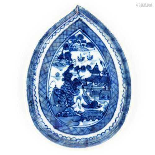 A Chinese dish made of porcelain with a blue-white landscape...