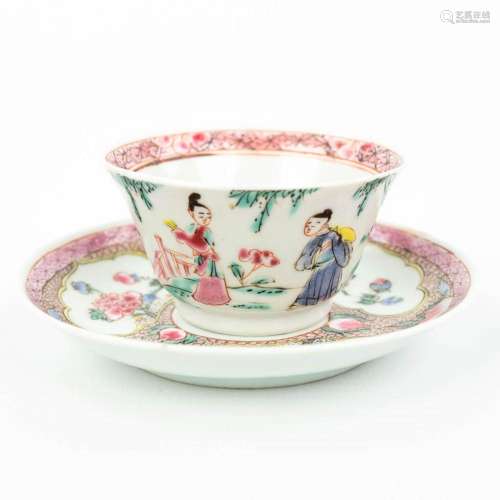 A Chinese cup and saucer with hand-painted decor, probably Q...