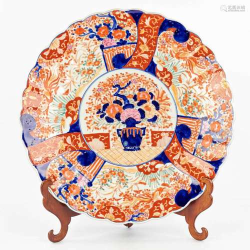 A large Japanese plate made of Imari porcelain.