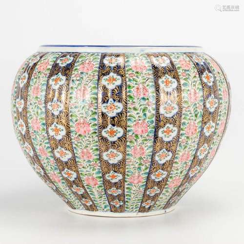 A large Japanese cache-pot, with hand-painted floral decor. ...