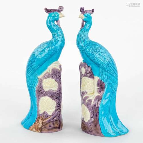 A pair of Chinese Phoenix made of glazed stoneware. 20th cen...