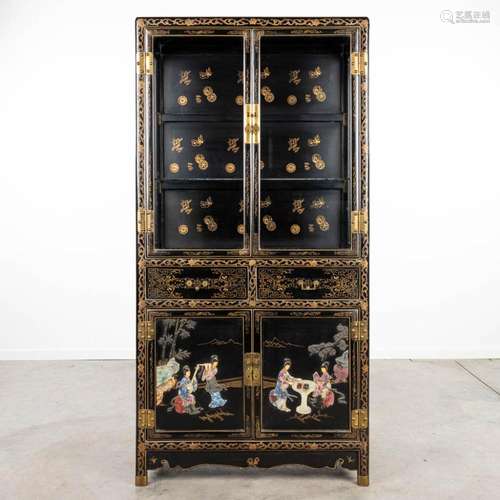 A Chinese display cabinet in Oriental style and finished wit...