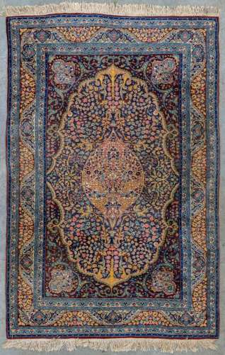 An oriental hand-made carpet. (228 x 148 cm)