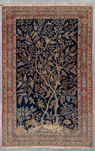 An antique hand-made carpet 'Ghom', made in Iran. 32...