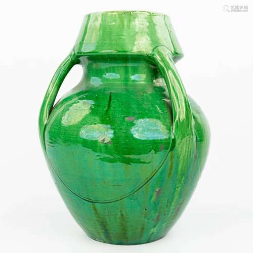 A large vase made of Flemish earthenware with green glaze. (...