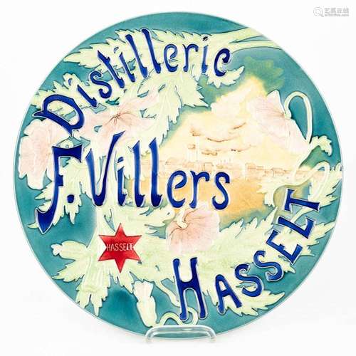 A large glazed faience plate 'Distillerie F. Villers, Ha...