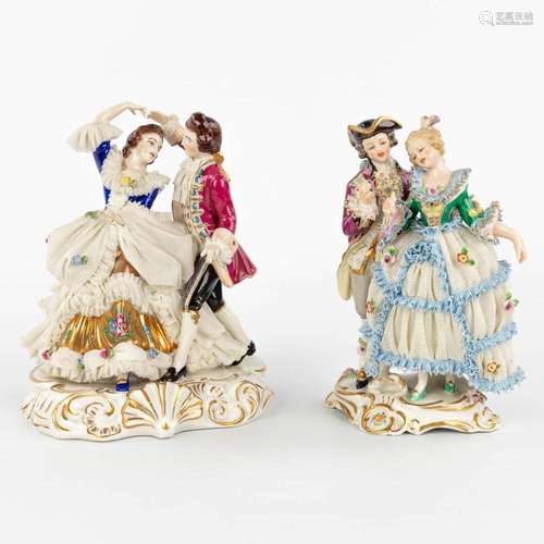 A pair of porcelain figurines with a lace dress. Made in Ger...