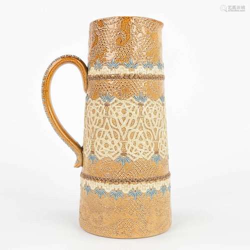 A pitcher made of stoneware and marked Doulton Lambeth Slate...