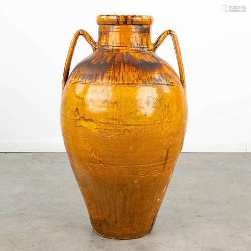 A large and decorative vase made of glazed earthenware, Made...