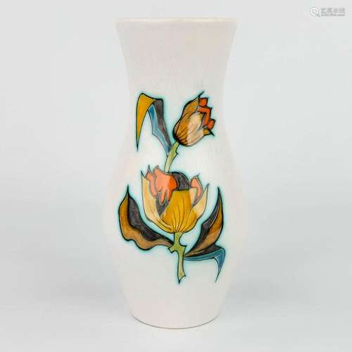 A vase with flower decor and marked Flora Gouda Holland Rimi...