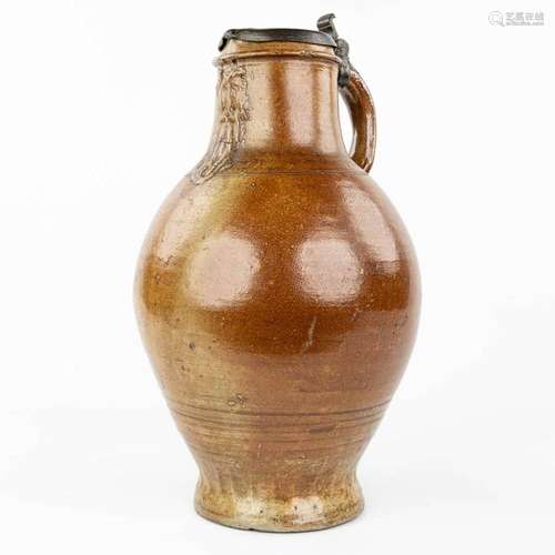 A large and antique Bartmann Jug with lid made of tin. (H:49...