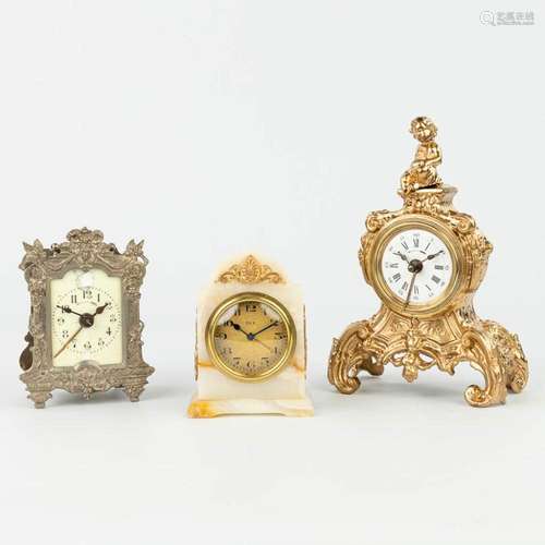 A collection of 3 small table clocks made of bronze, onyx an...