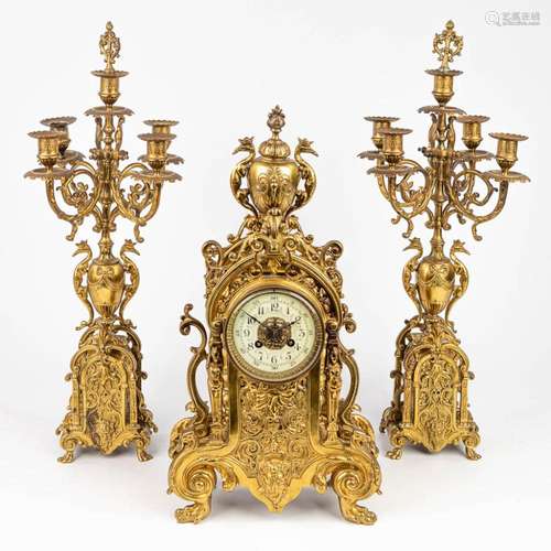 A three-piece mantle clock made of bronze. (H:50cm)