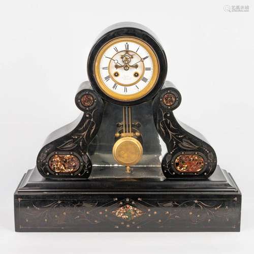 A table clock made of black marble with red marble inlay and...