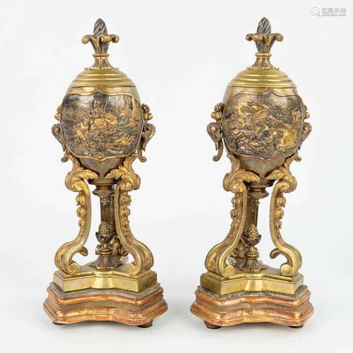 A pair of bronze cassolettes with images of knights in battl...